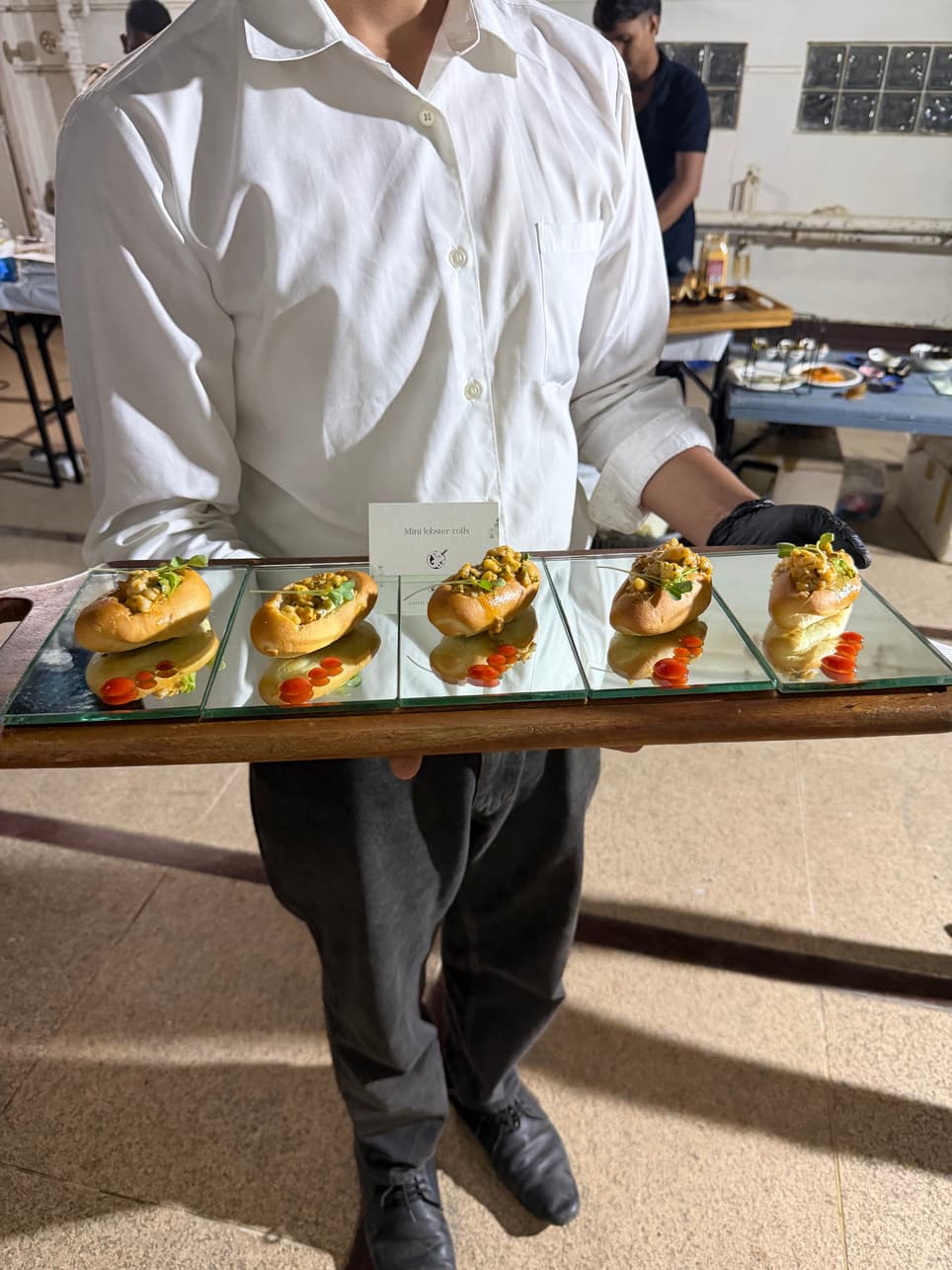 Canapés presented on a mirrored tray